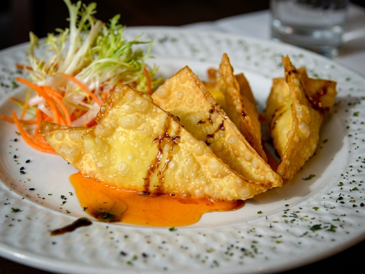 Golden crispy Crab Rangoon with sweet chili dipping sauce